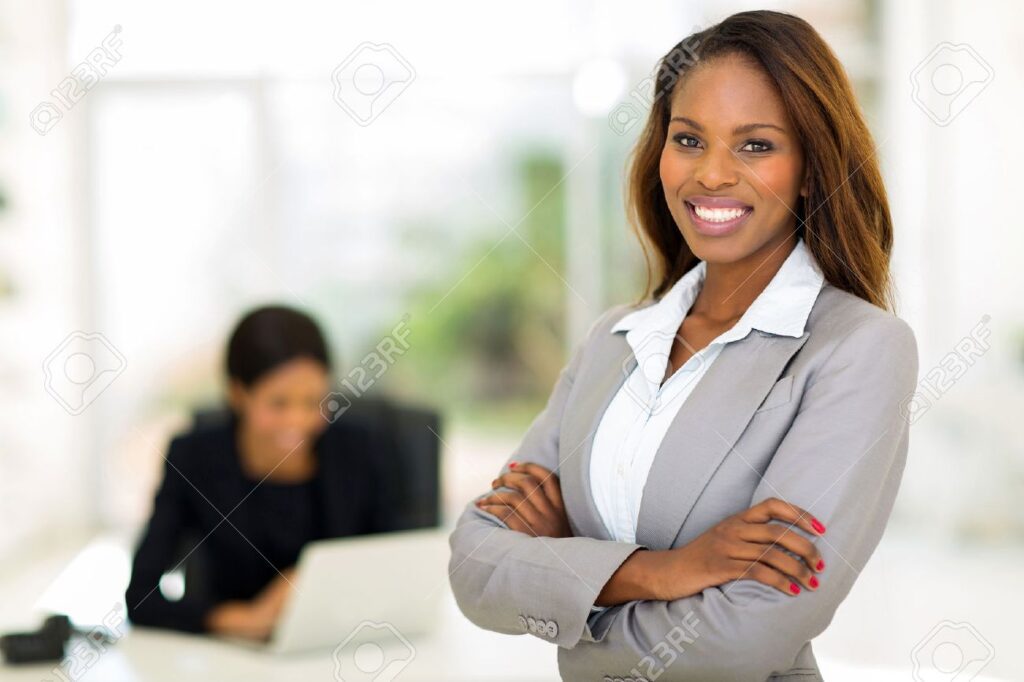 A woman standing in front of another person.